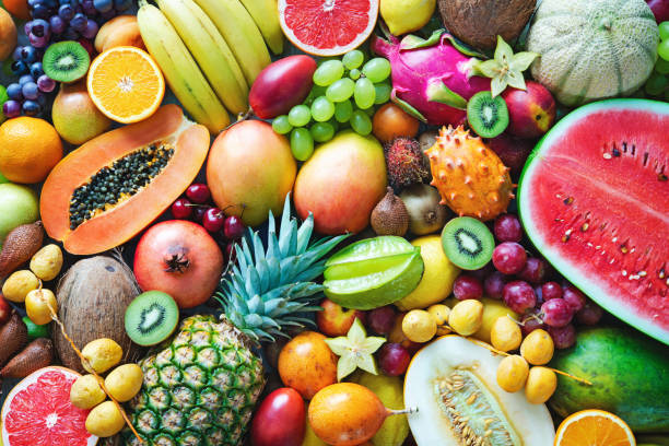 Food background. assortment of colorful ripe tropical fruits. top view